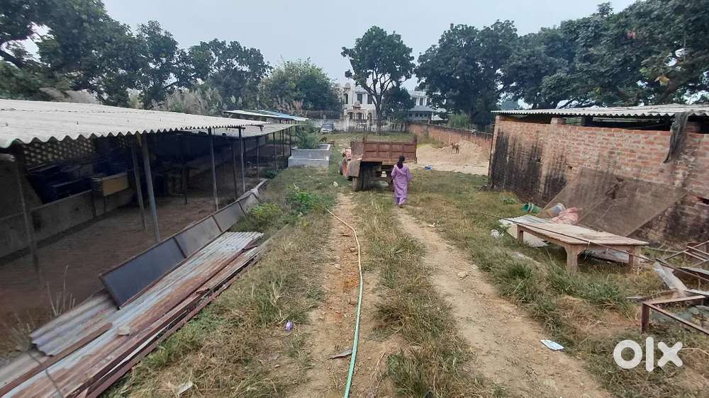 A large plot with 2 room and a water pump with a tin sheded area