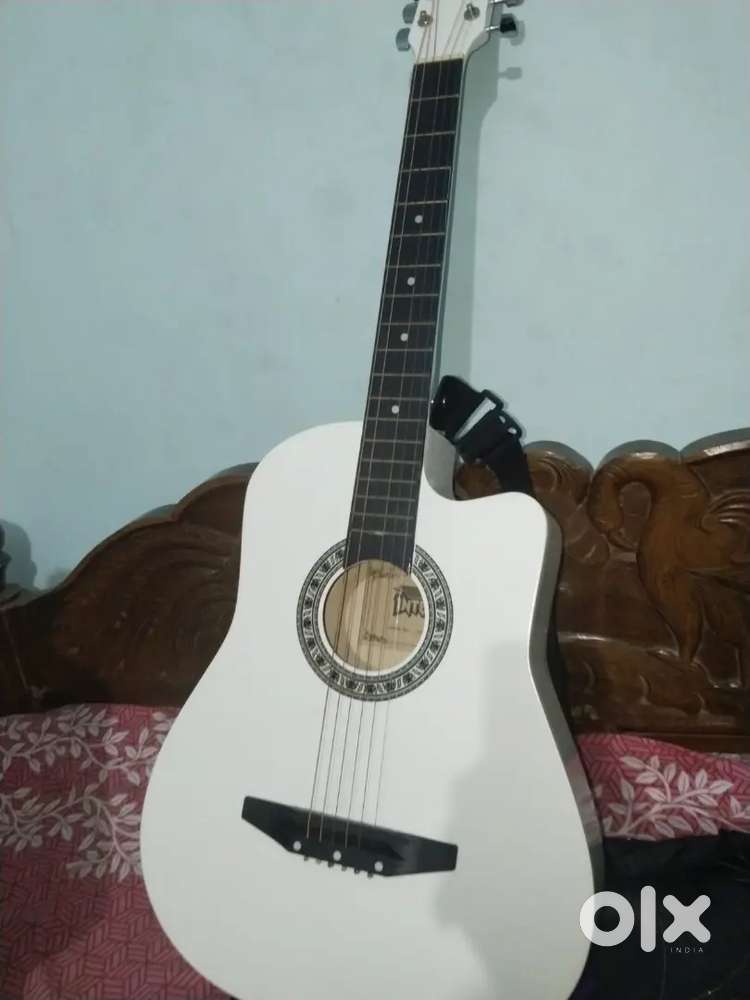 Musical guitar new condition extra strings available