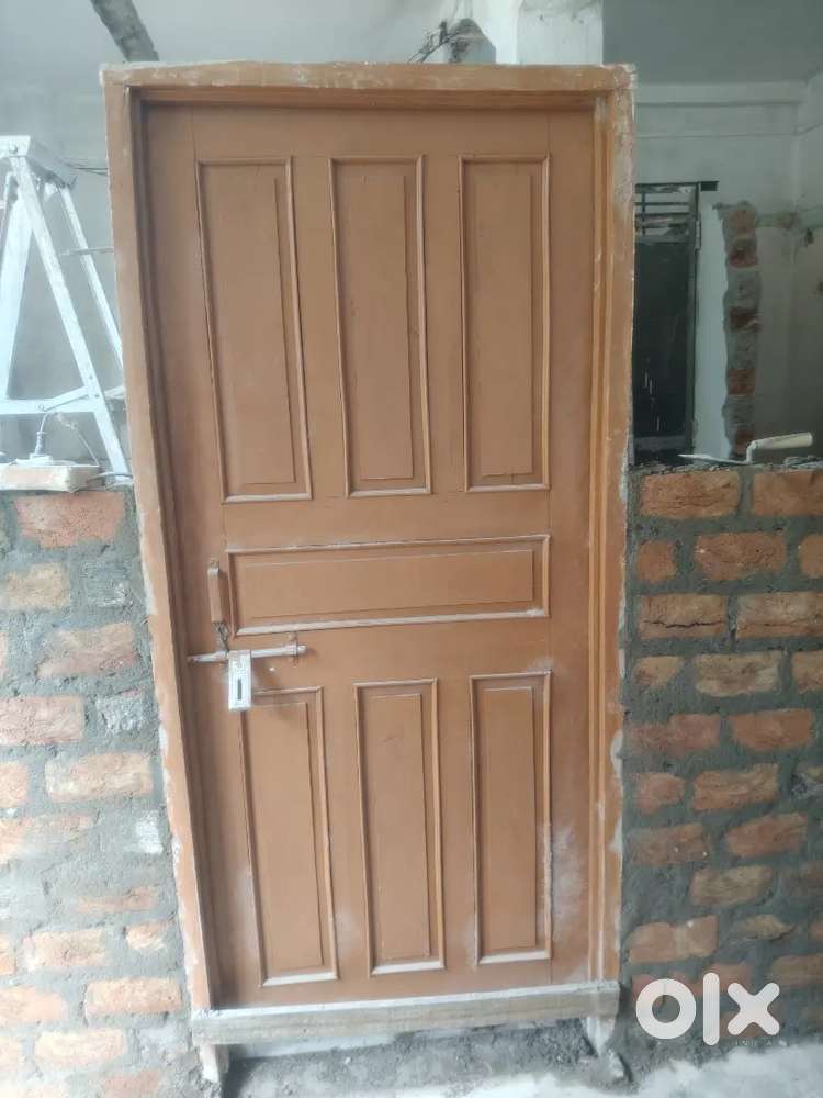 Used Door with Frame & Window (Iron Net Attached) – Good Condition