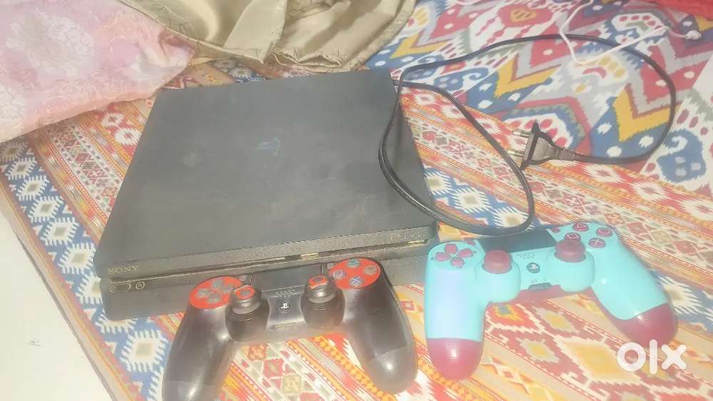 PS4 Slim 1 TB with 2 controllers good condition
