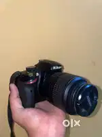 Nikon D3200 with 18-55mm lens and new tripod