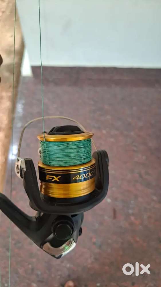 FISHING ROAD AND REEL ONLY TWO MONTH USE