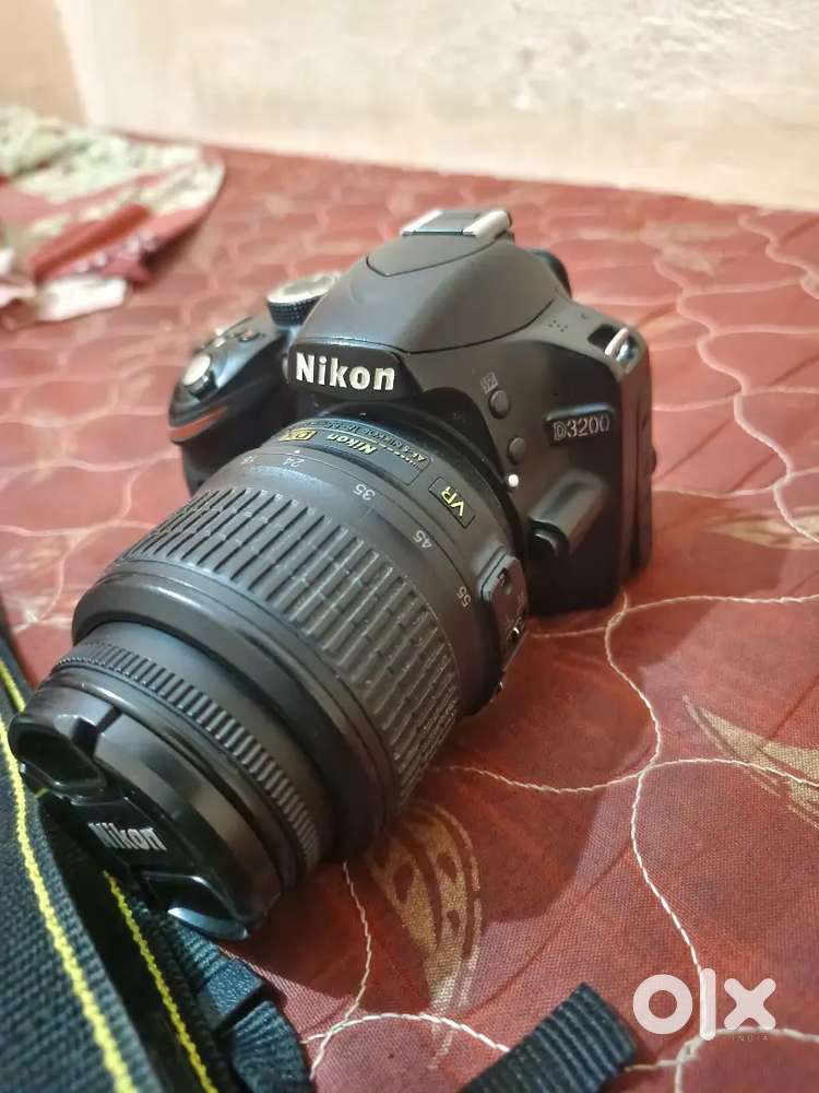 Original charger, 2 battery, original belt, and original camera Bag,