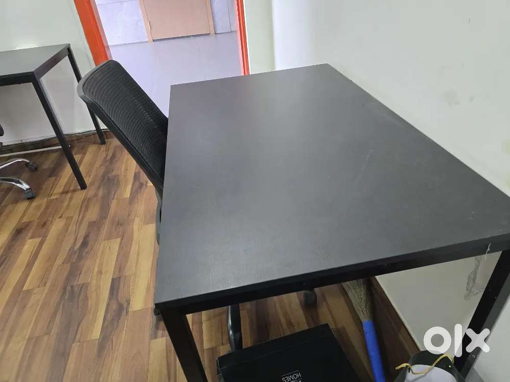 Office table and rolling chairs