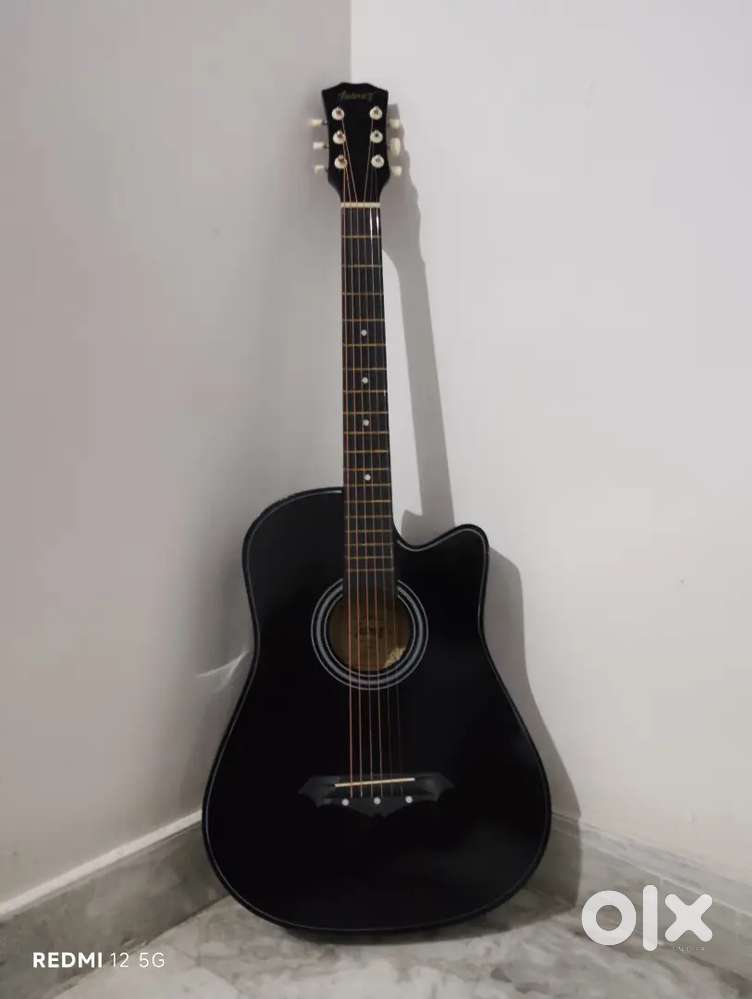It is a Acoustic for sale and free accessories carry bag belt and key