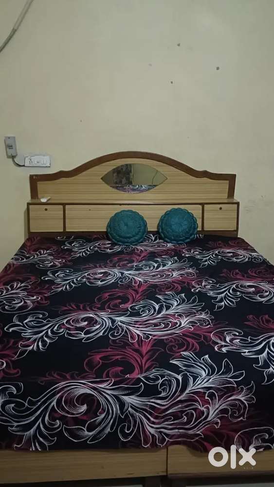 Two room kitchen bathroom furnished bed almirah fan.