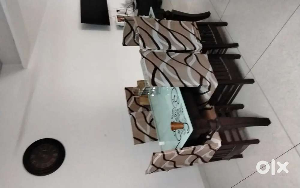 Elegant 6 seater wooden dining table with glass top & chairs