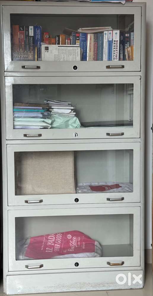 Steel book rack with glass shelves for sale