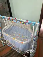 Baby cradle with swing and mosquito net