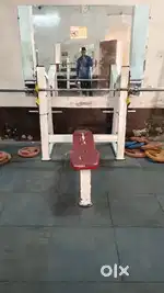 Complete gym setup for sell with water cooler , gym tiels, and mirror