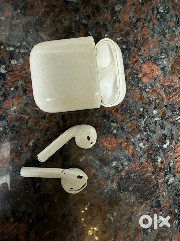 Apple Airpods (2nd Generation) pair. (One earbud has a visible crack)
