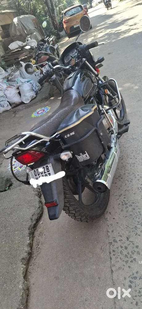 It is a Royal Black and steel finished retro model bike