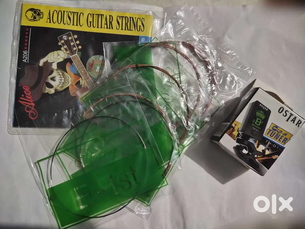 Acoustic guitar strings and guitar clip on tuner