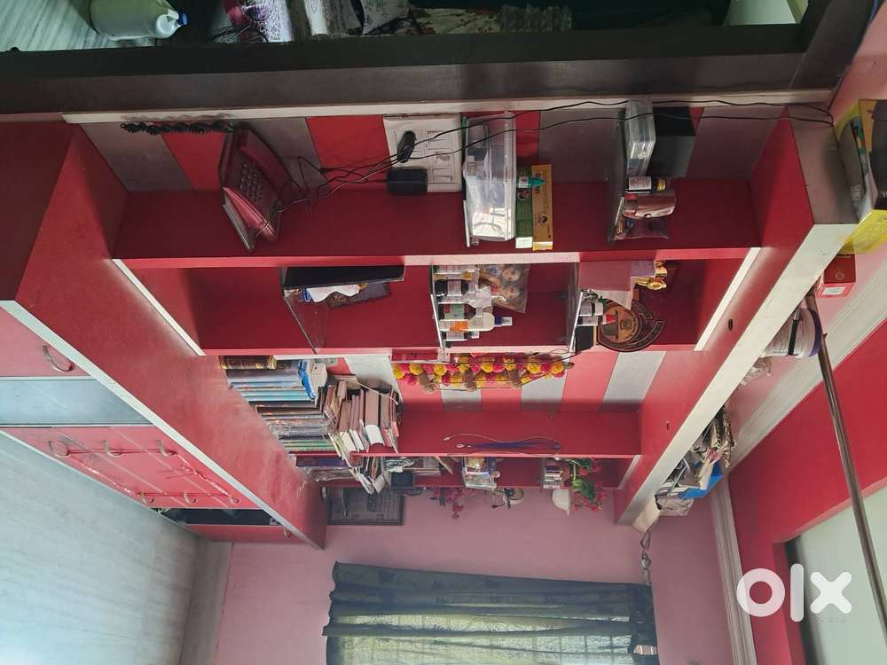 Spacious 13-year-old 2 BHK flat with 2 bathrooms, covered garage