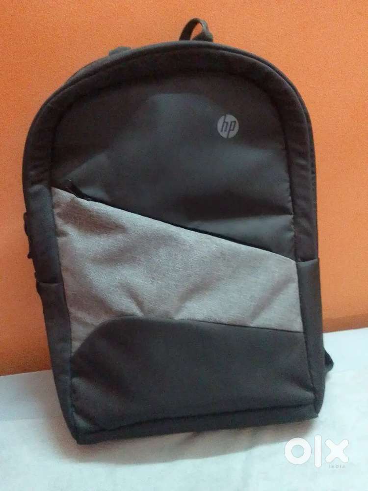 HP laptop with charger and mouse bag also