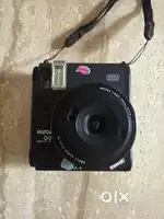Gives out instant credit size print of photo and has coloureffect dail