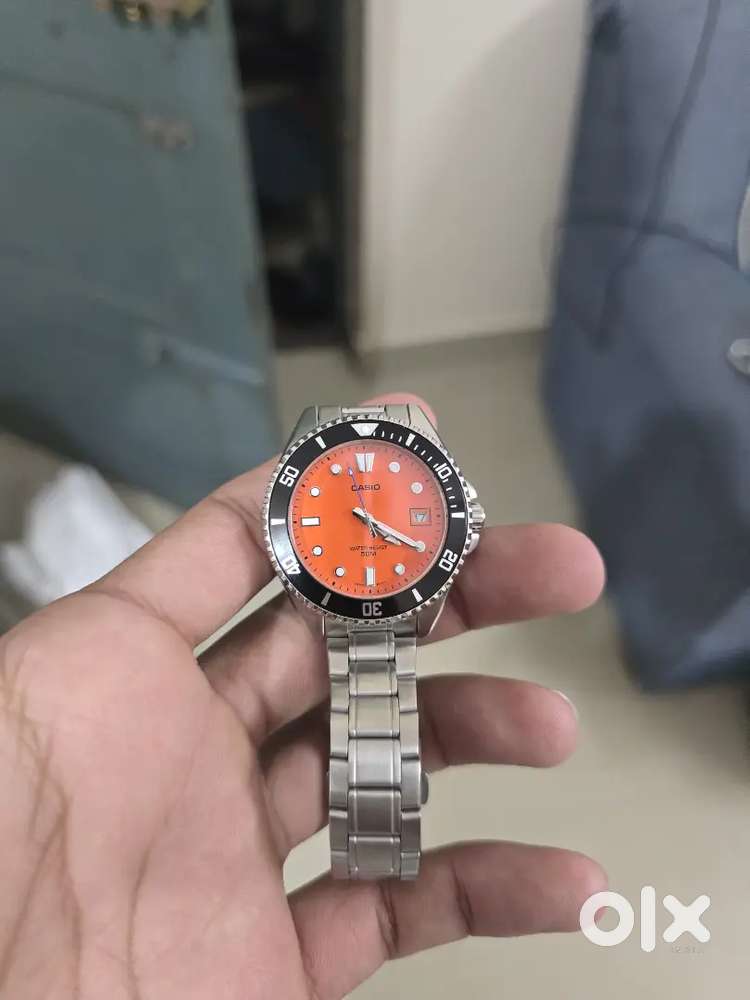 Casio MDV-10D-4A2V orange dial, stainless steel bracelet.