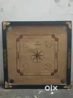 Carrom board with carrom coin with 2 extra striker