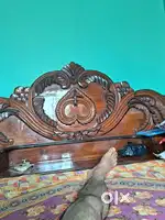 One wooden bed to be sold.