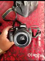 Nikkon camera D5100 with 18-55 and 70-300 lens origanal bag n battery