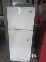 Whirpool company fridge with stabiliser and stand