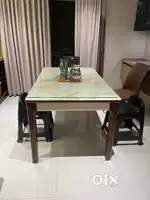 Dining with white artificial marble top