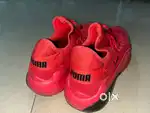 Puma red running shoes