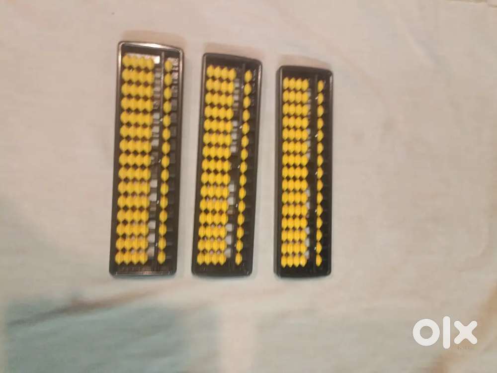 Abacus An abacus is a hand-operated calculating tool that uses beads s