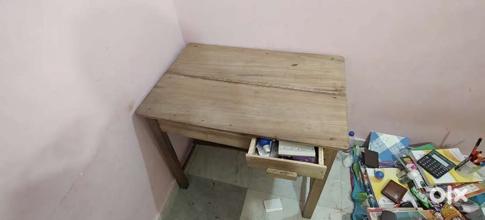 Wooden table and plastic chair