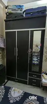 Wooden almirah and bed
