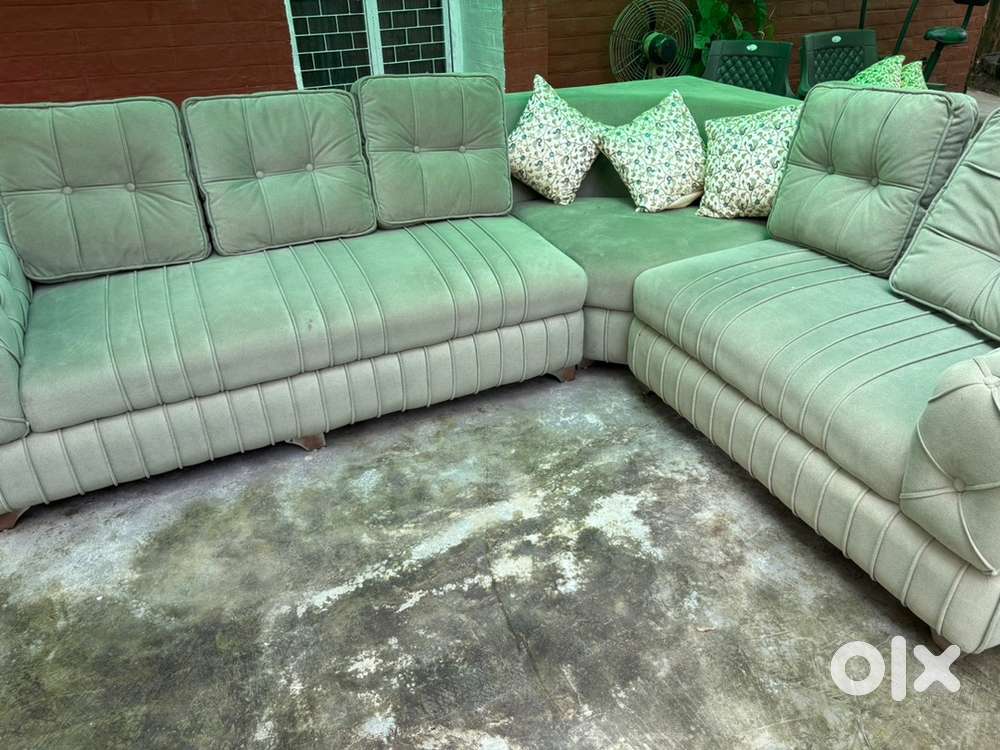 Hey its a very beautiful l shafe sofa in olive green