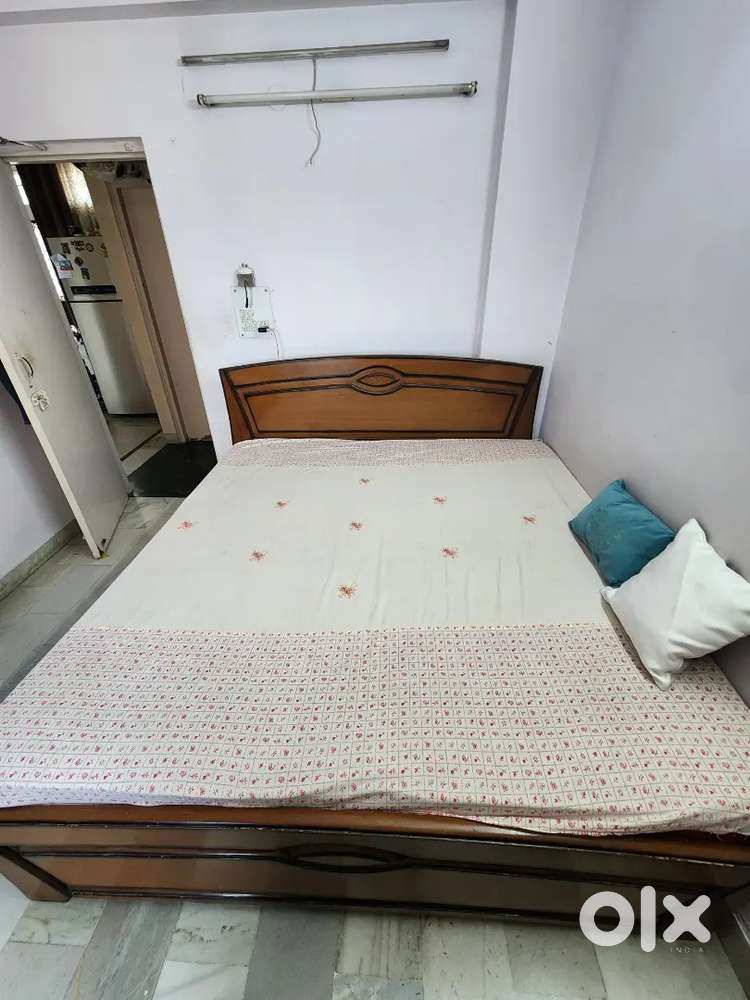 King size bed without mattress.