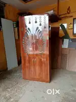 Pooja Wardrobe with a modern CNC cut door