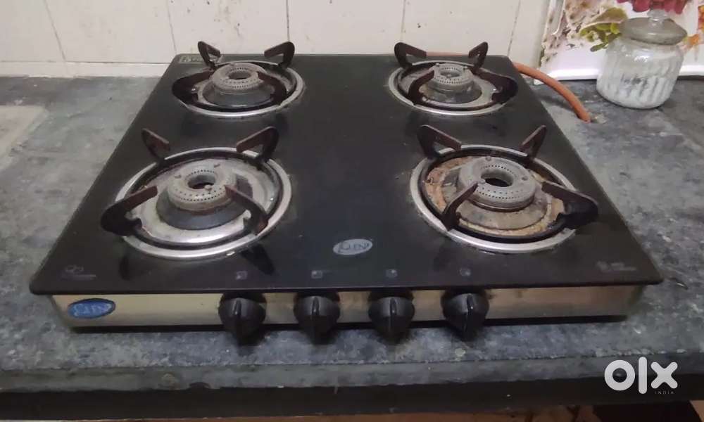 Four burner stove, fridge and water purifier