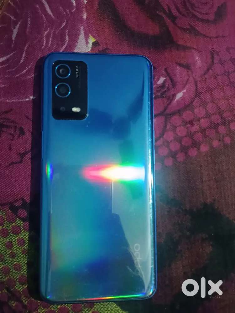 Oppo A55 with charger and box.