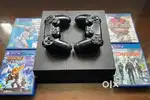 Ps4 1 TB console with 2 controllers and 4 game discs