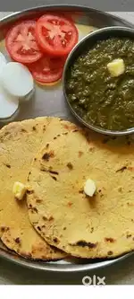 Sarson ka saag or makke ke roti, with bundi raita or salad