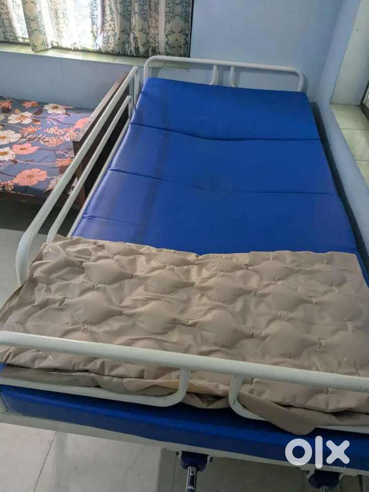 Blue cot, mattress and bed frame