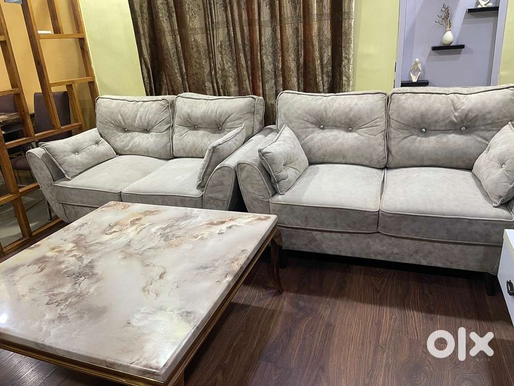 Strudy 7 seater Sofa with marble centre table is available