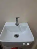 Hand wash basin with steel tap