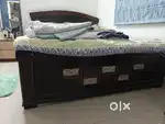 Bed with mattress and topper