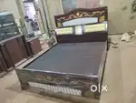 Band new qeen size with storage head storage cot