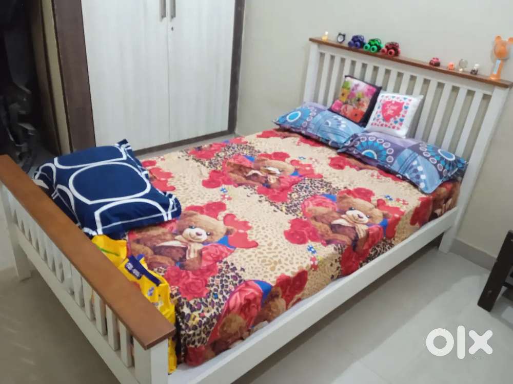Fancy bed wooden 6.3*5 size with mattress on bed that is sofa cumbed