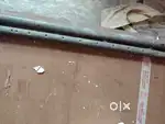 A wooden folding bed
