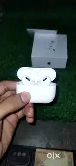 Airpods pro earbuds with charging cable and box