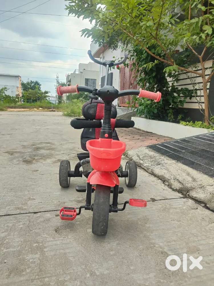 Kids tricycle with parental control.