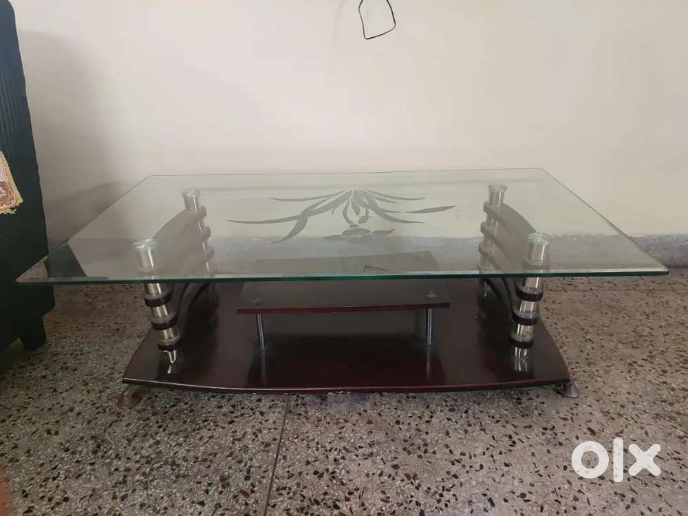Glass top wooden center table