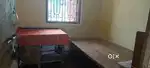 Single room with bed, table & bathroom