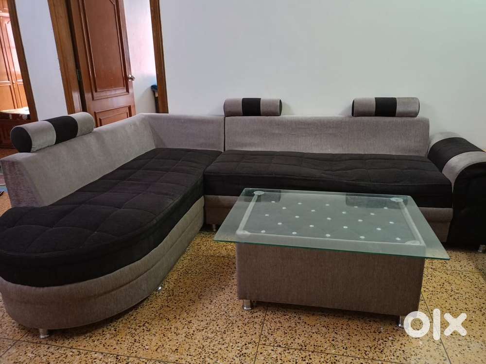 L shaped sofa with centre table