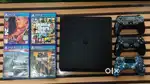 PS4 slim with 3 remote control and 4 games